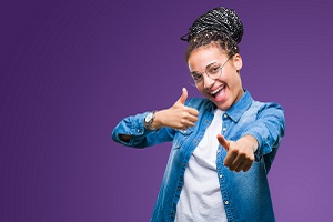 Young Woman Giving Thumbs Up 